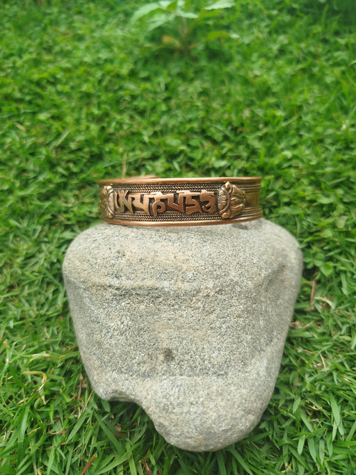 Copper bracelet for men om mani top view